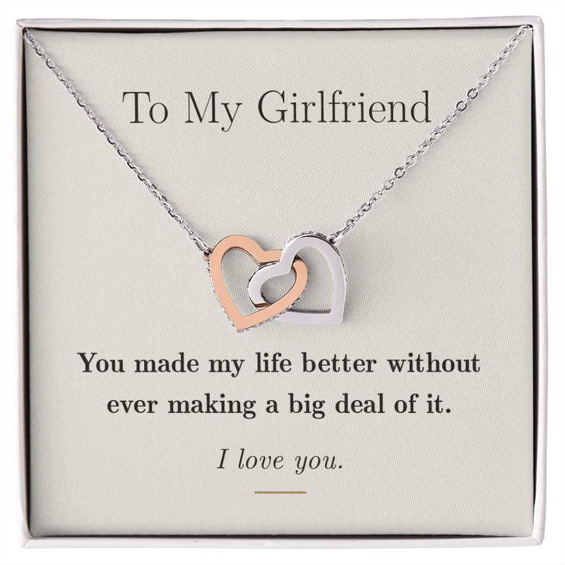 Interlocking hearts necklace in silver with a rose gold second heart