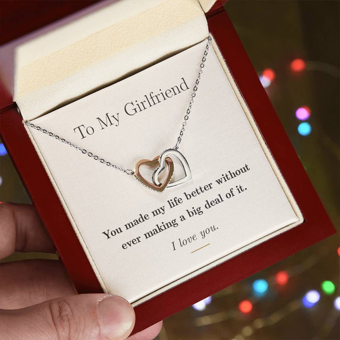 The gift box open with its LED spotlight lighting the necklace